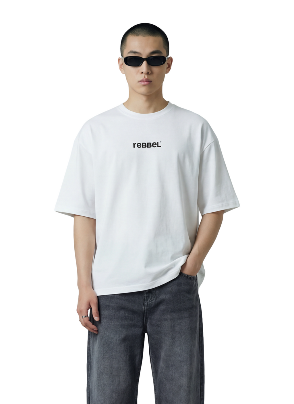 Person wearing a white t-shirt with 'rebel' text and dark jeans on a white background